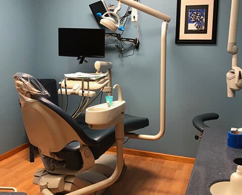 A patient room at the dentist's office.